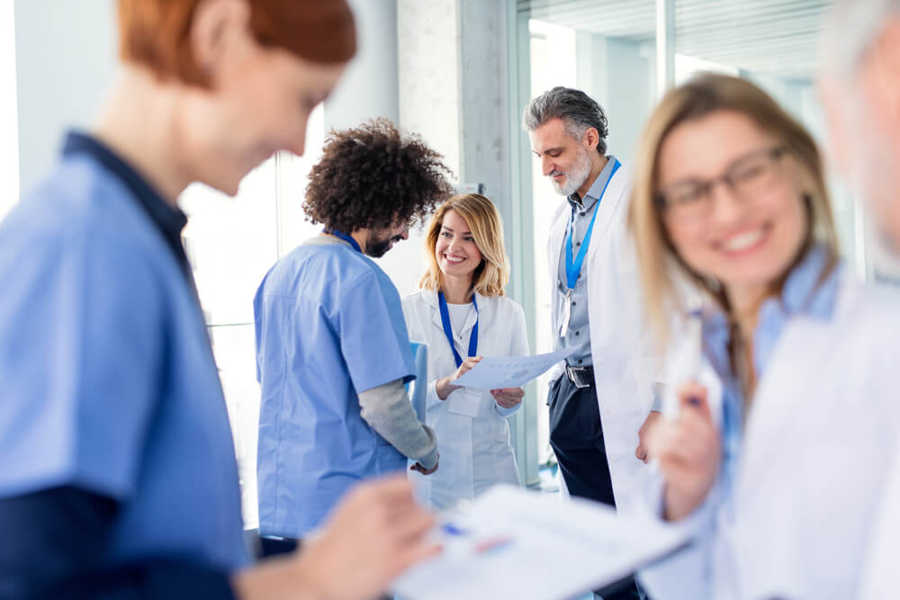 Group of doctors on conference, medical team discussing issues.