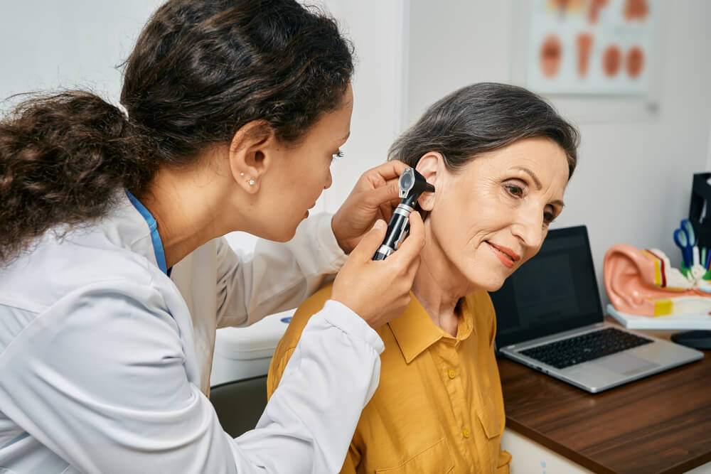 Hearing exam for elderly citizen people.