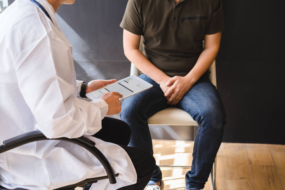 Male doctor and patient