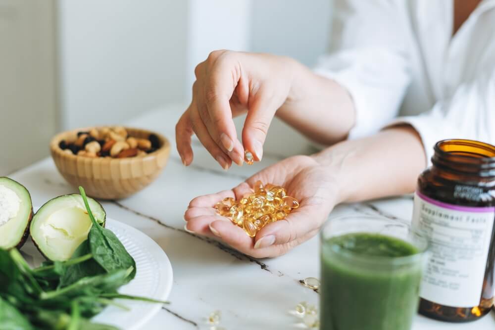 Vitamin D capsules with green vegan food
