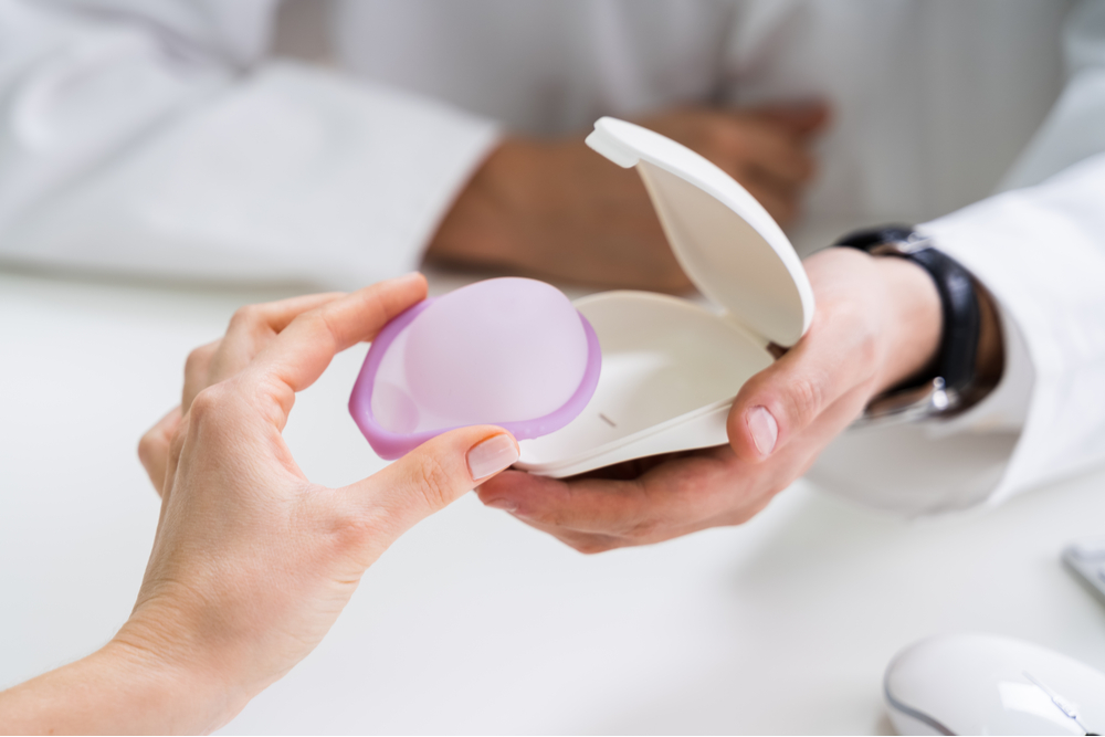 Gynecologist Consulting Woman On Diaphragm