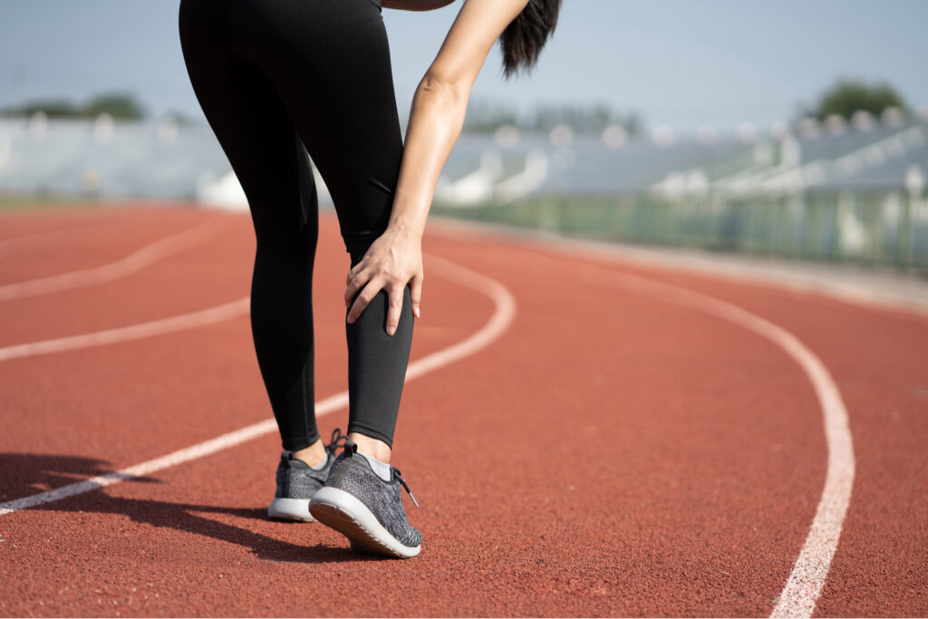 woman with leg pain after morning outdoor exercise