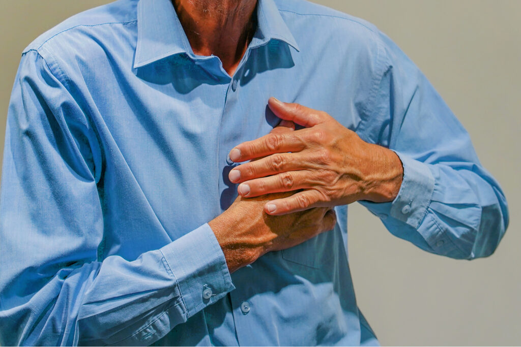 Senior man suffering from heart attack