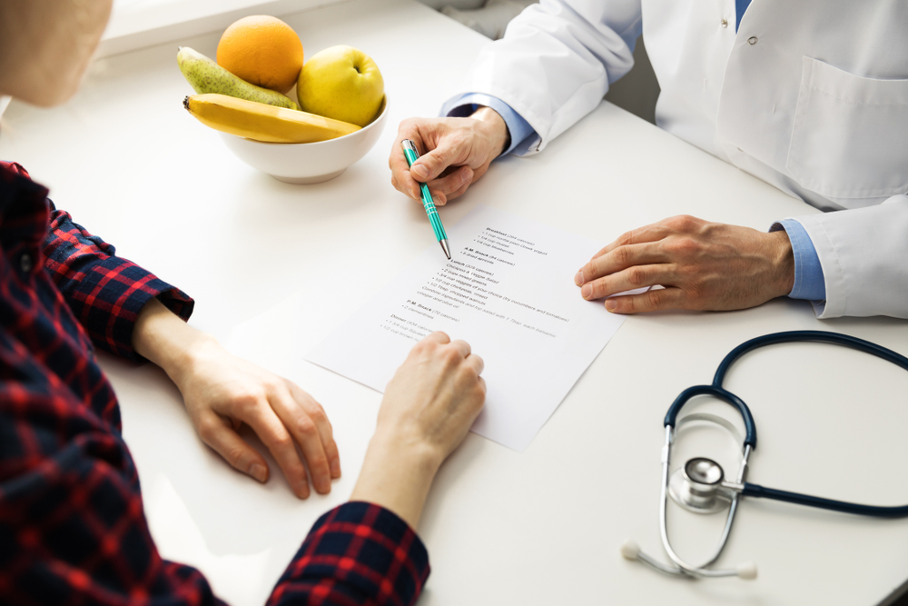 Doctor talking to patient about Medical Weight Loss